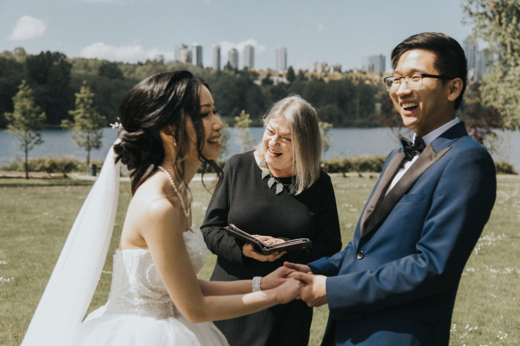 Bride and groom read vows at Hart House-Deer Lake in Burnaby BC, taken by 48 Studio