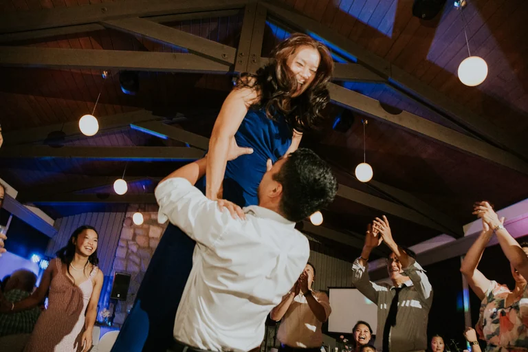 Bride and groom dancing together at the reception
