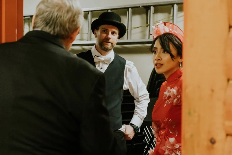 Bride and groom greeting family during a traditional ceremony