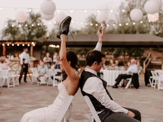 Bride and groom playing a wedding reception game