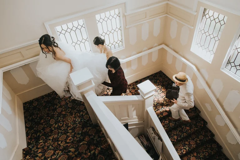 Bride and groom preparing on a staircase