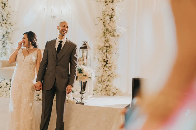 Bride and groom standing together at the ceremony