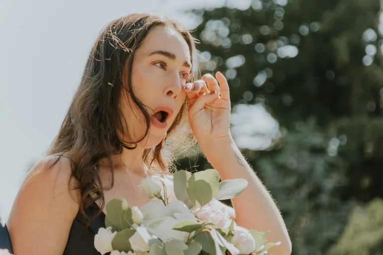 Bride laughing with a wedding guest