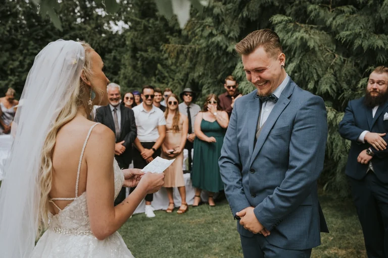 Bride reading wedding vows to the groom