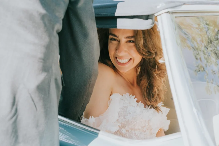 Bride smiling beneath her veil