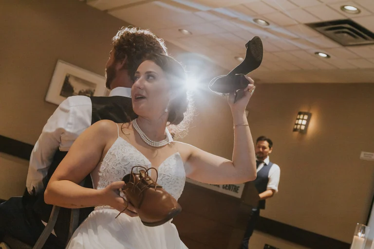 Bride speaking into a microphone at the reception