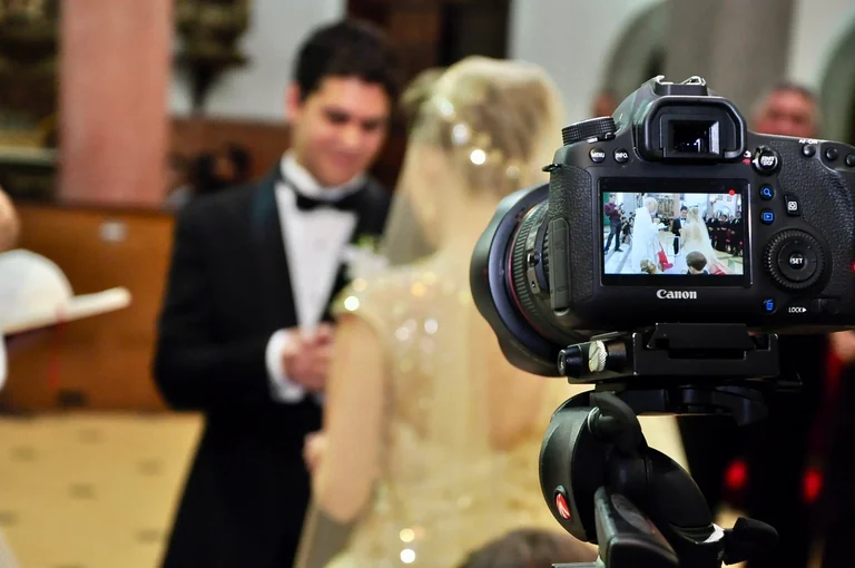Camera filming a wedding reception speech
