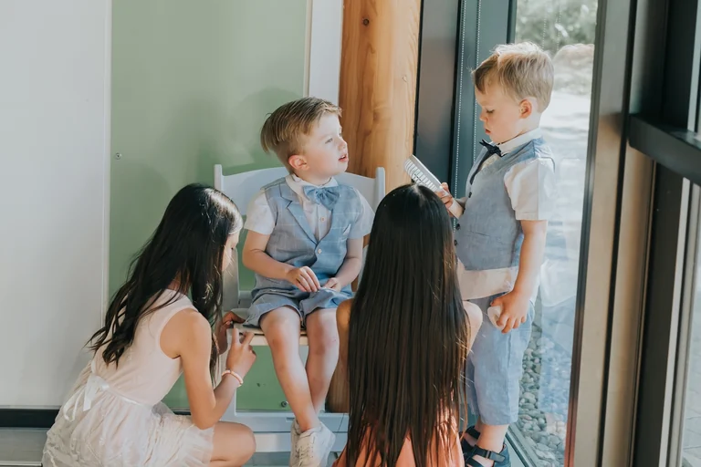 Children spending time with guests during wedding preparations