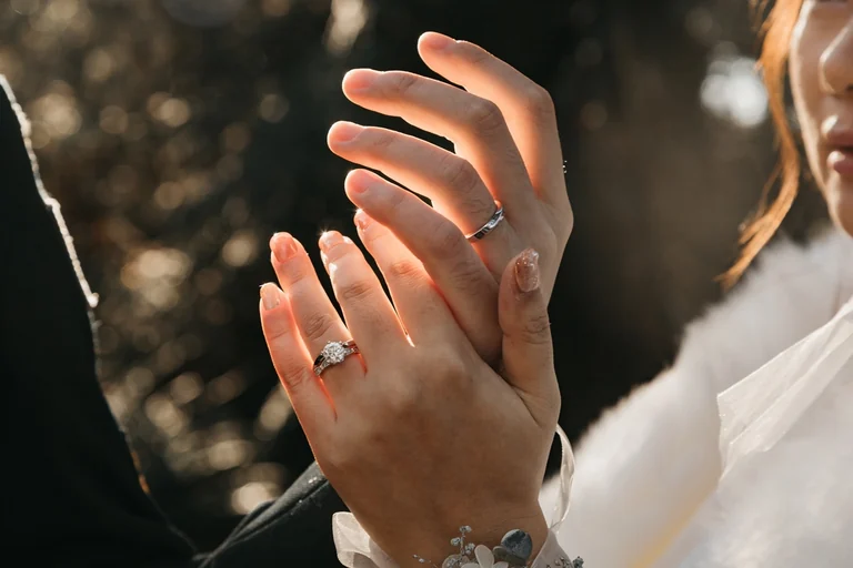 Close-up of a bride's hands and engagement ring