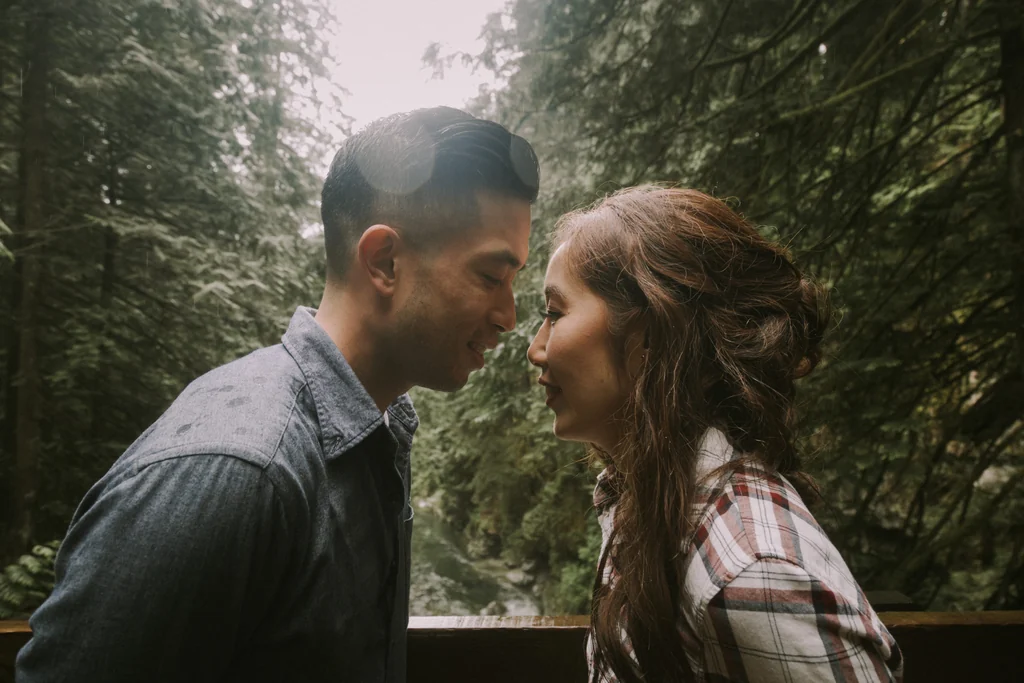 Couple embracing among forest trees