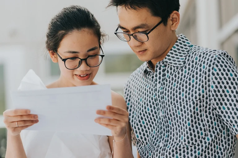Couple reading a card together