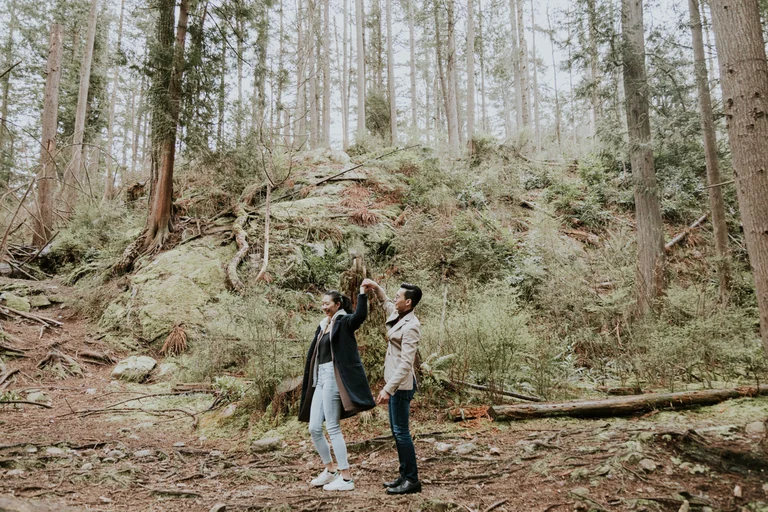 Couple walking along a forest trail