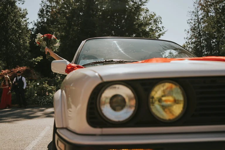 Front of a decorated vintage wedding car
