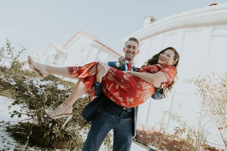 Groom carrying the bride during wedding games