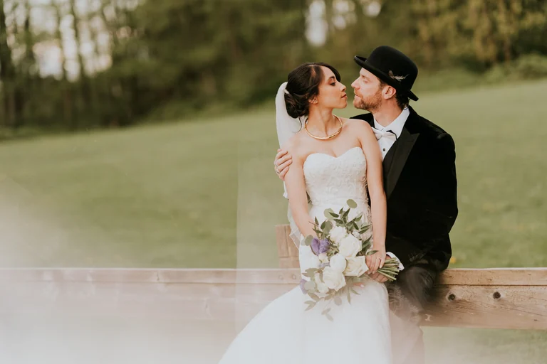 Groom kissing the bride on her cheek