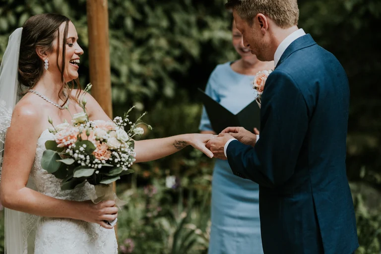 Groom reading wedding vows to the bride