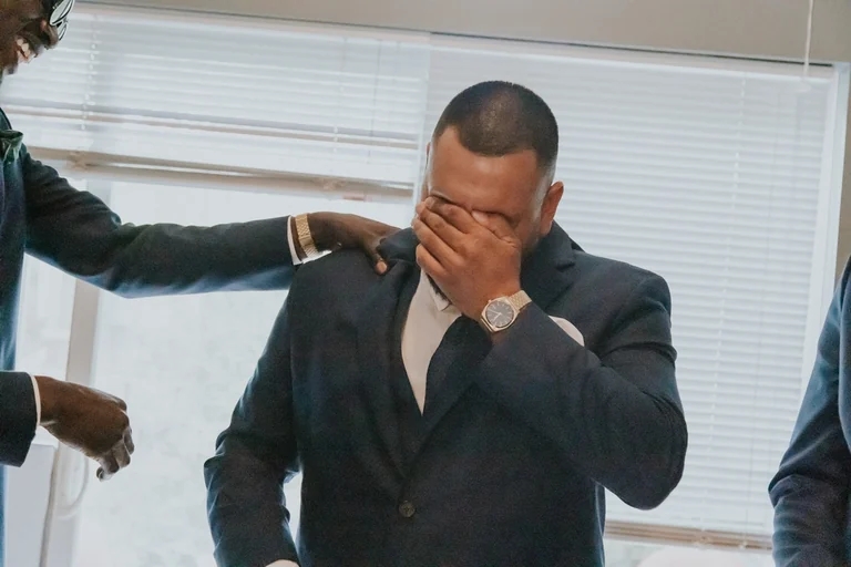 Groom wiping a tear before the ceremony