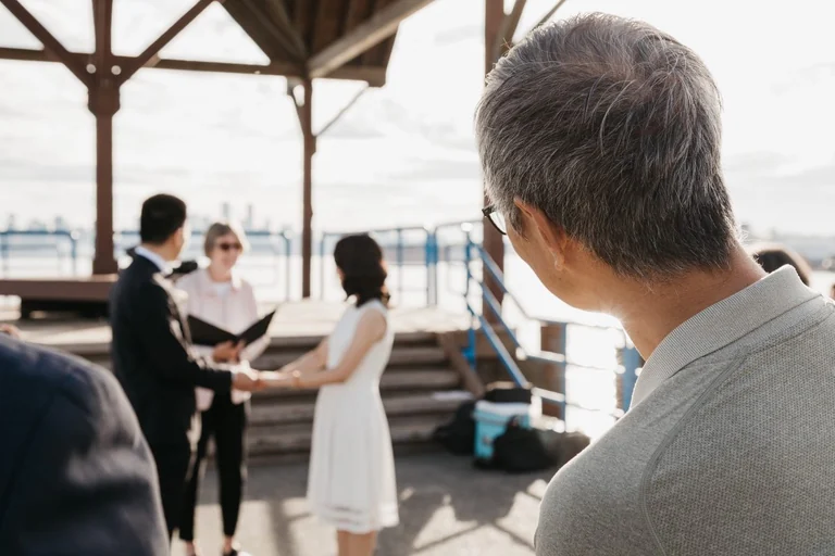 Guest watching a wedding ceremony