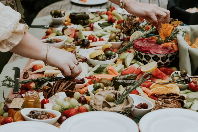 Guests choosing food from a wedding buffet