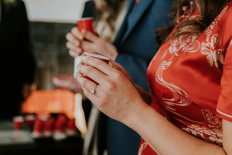 Hands presenting gifts during a traditional wedding ceremony