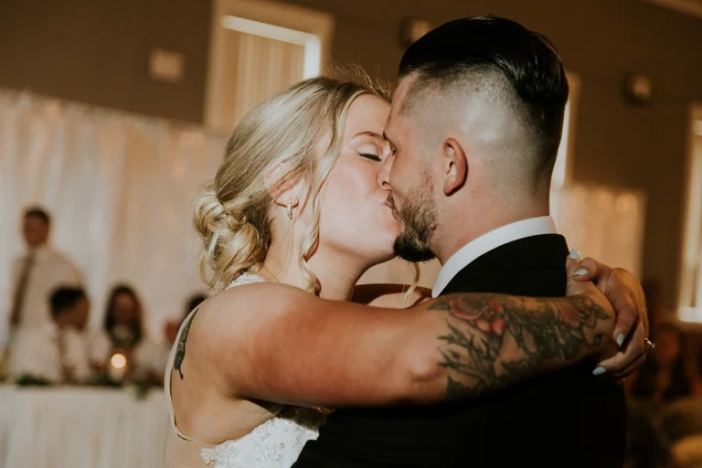 Newlyweds embracing during their first dance