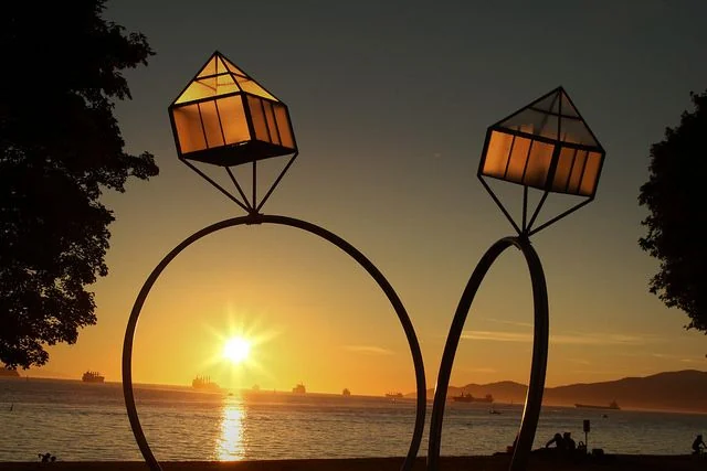 Sunset reflected between two engagement rings