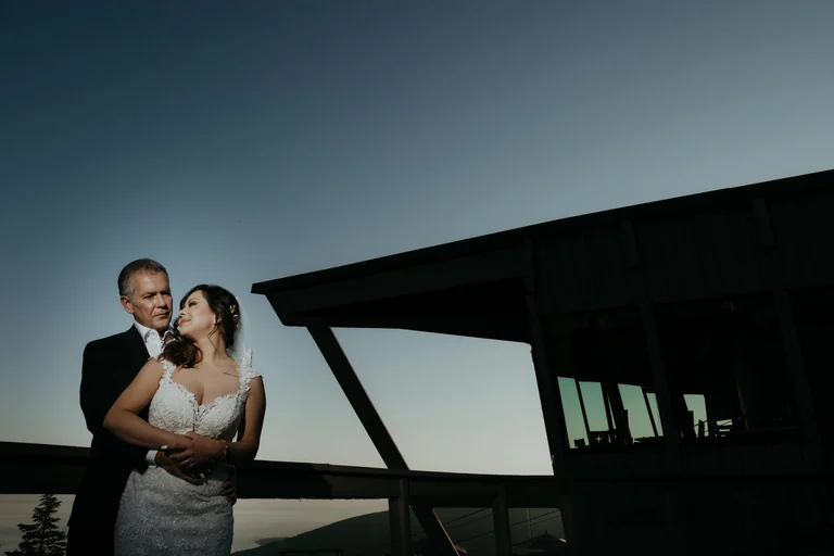 Wedding couple embracing in evening light