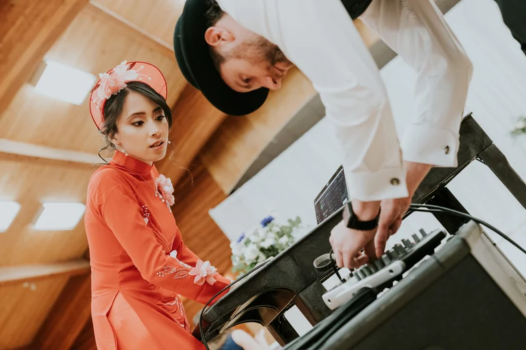 Wedding couple playing a keyboard together