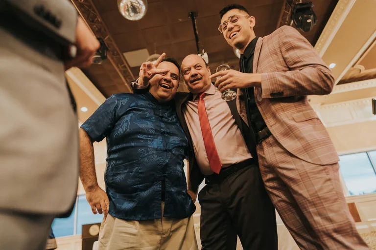 Wedding guests posing together for a photograph