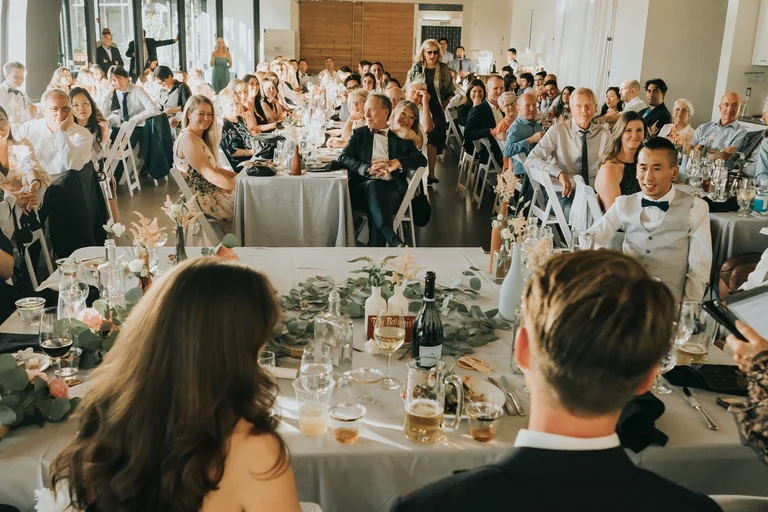 Wedding guests seated around reception tables