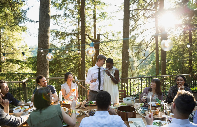 Wedding guests sharing a meal outdoors