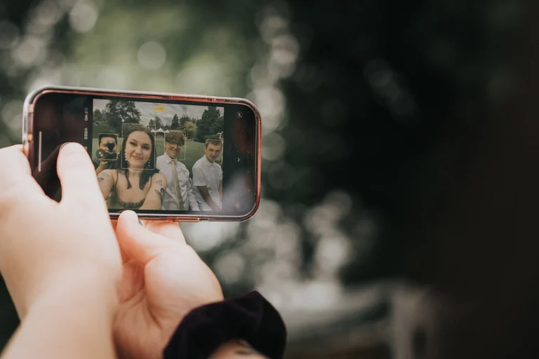 Wedding guests taking a group selfie