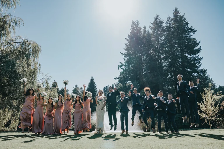 Wedding party celebrating together outdoors