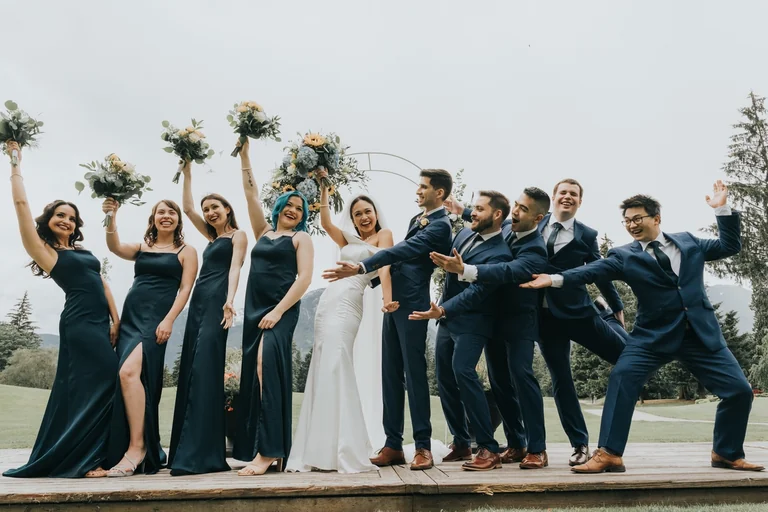 Wedding party posing together outdoors