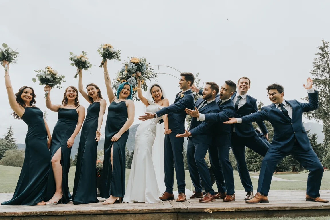 Wedding party posing together outdoors